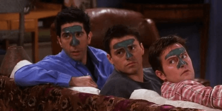 three men using cosmetics